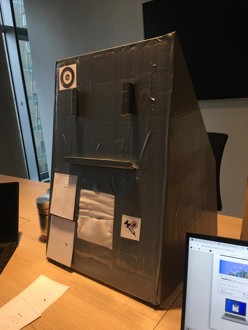 The cardboard and tape box which stands for the humanity assessment terminal